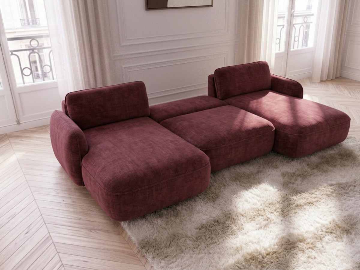 Canapé Céleste rouge avec son couchage déployé dans un salon